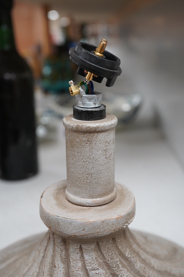 A pair of painted and carved wood lamps, 65cm to wood top